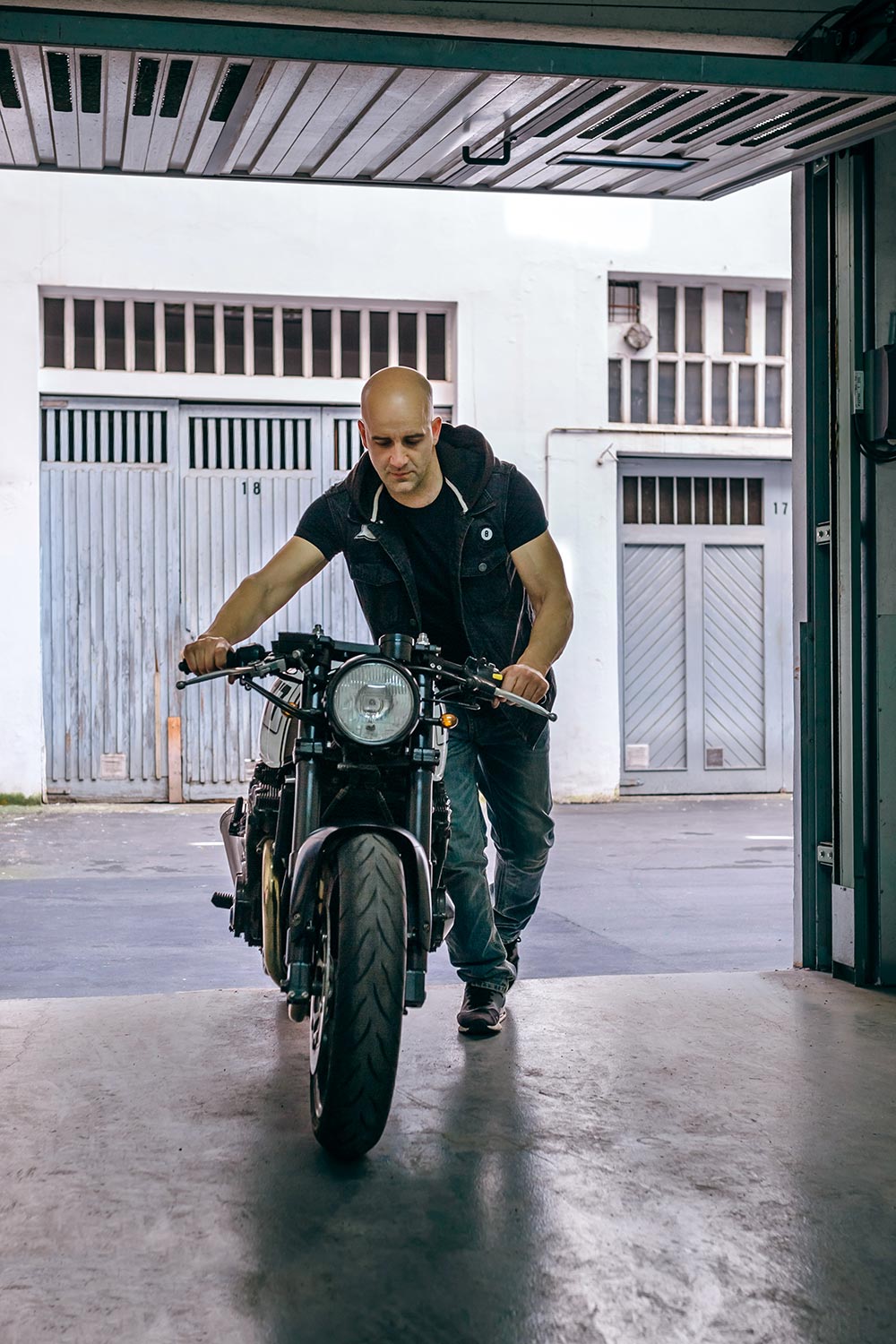 biker-taking-motorbike-to-the-garage-Z57S6QL-resize.jpg Biker taking motorbike to the garage z57s6ql resize.jpg
