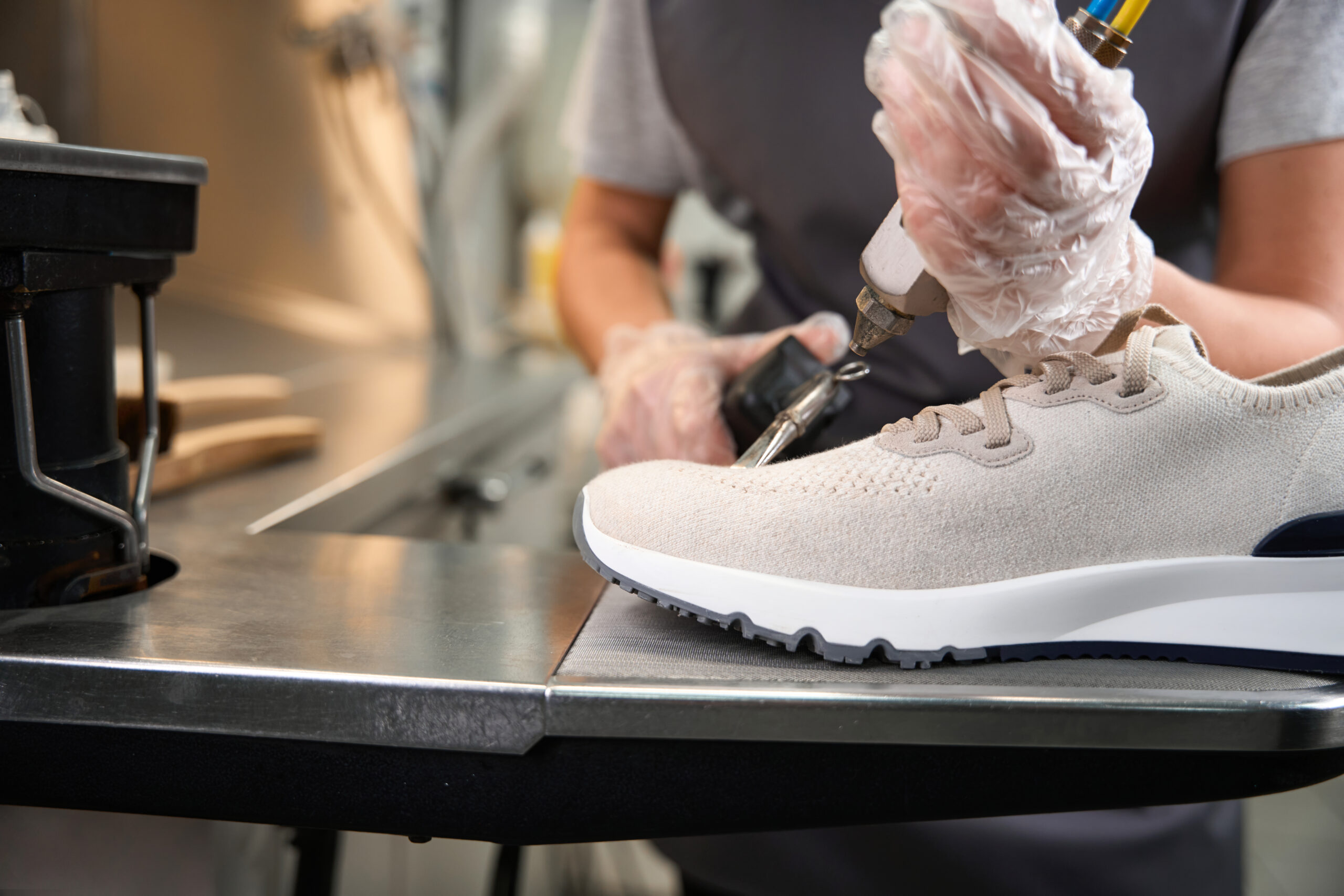 Close-up professional shoes cleaning with solvent and guns Close up professional shoes cleaning with solvent and guns