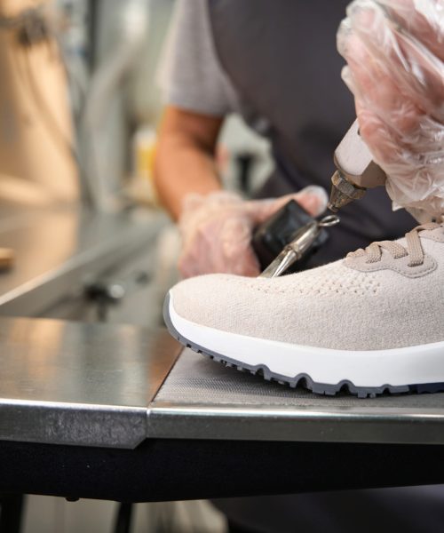 Close up professional shoes cleaning with solvent and guns